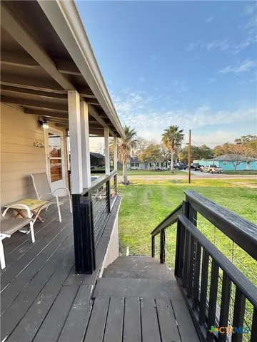 a swimming pool with an outdoor space and seating area