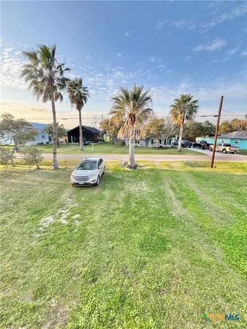 a kitchen with stainless steel appliances kitchen island granite countertop a refrigerator and microwave