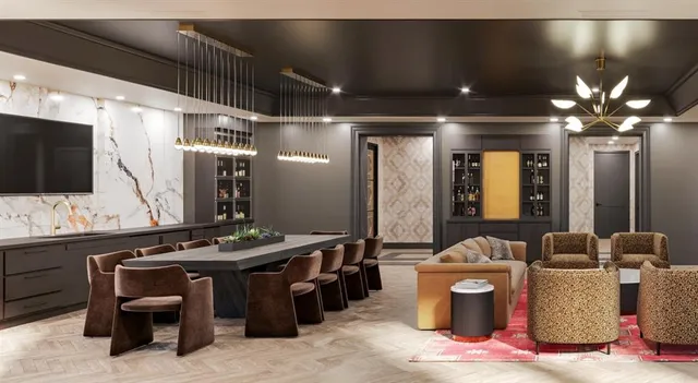 a large kitchen with kitchen island a dining table and chairs