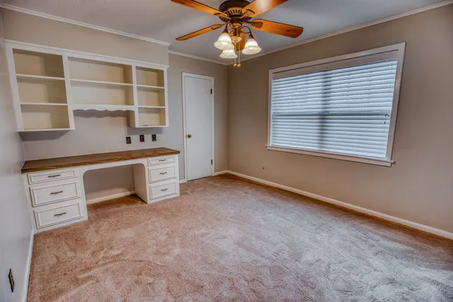 a room with window and cabinet