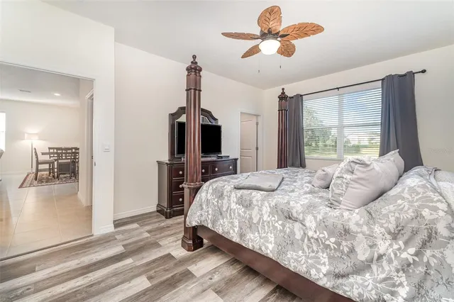 a spacious bathroom with a granite countertop sink and a mirror