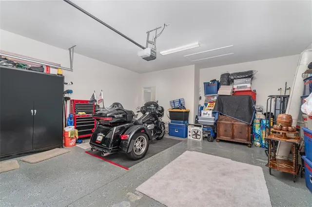 a front view of residential houses with yard and green space
