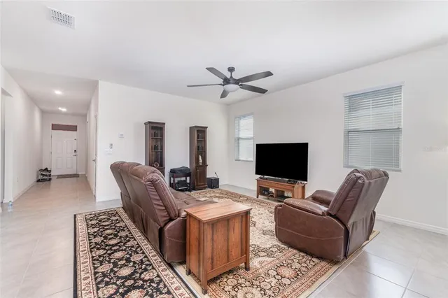 a view of a dining room with furniture and window