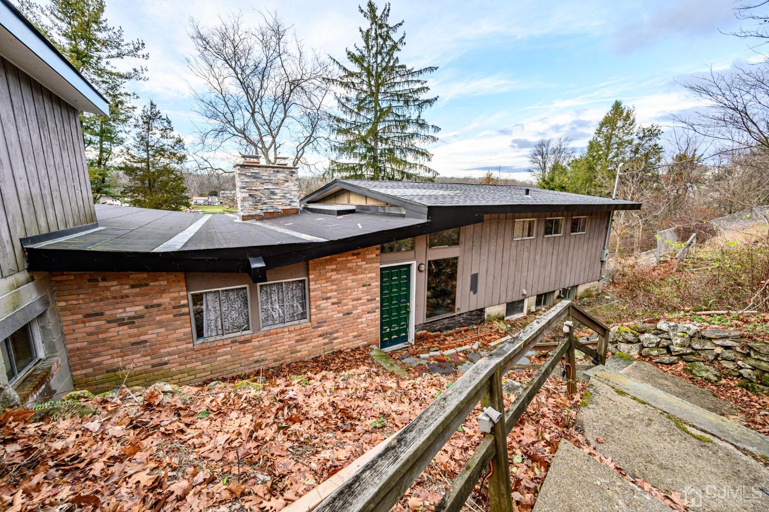 a backyard of a house with wooden fence