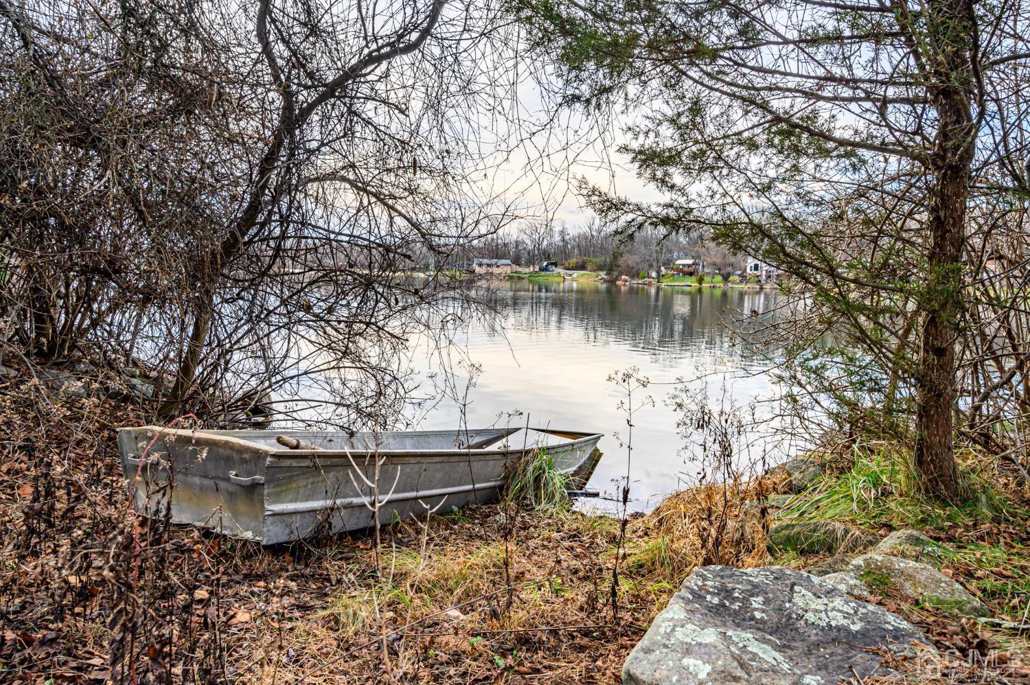 43 Shore Road Andover, NJ 07821 - Photo 11 of 25 a view of a lake with a large trees
