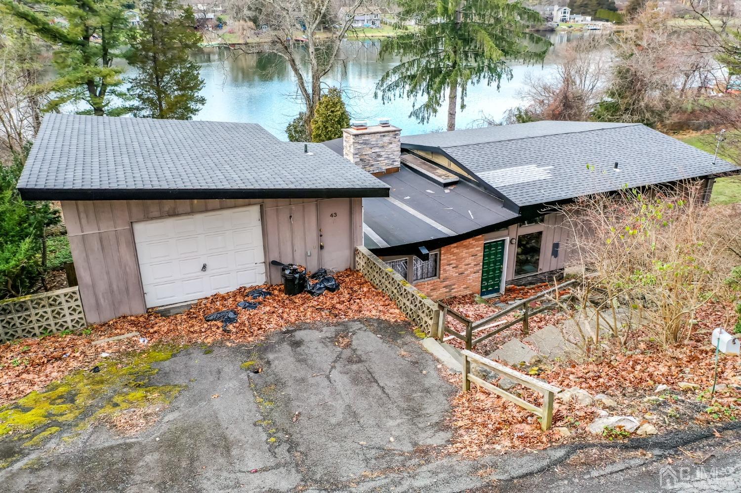 43 Shore Road Andover, NJ 07821 - Photo 13 of 25 front view of a house with a yard