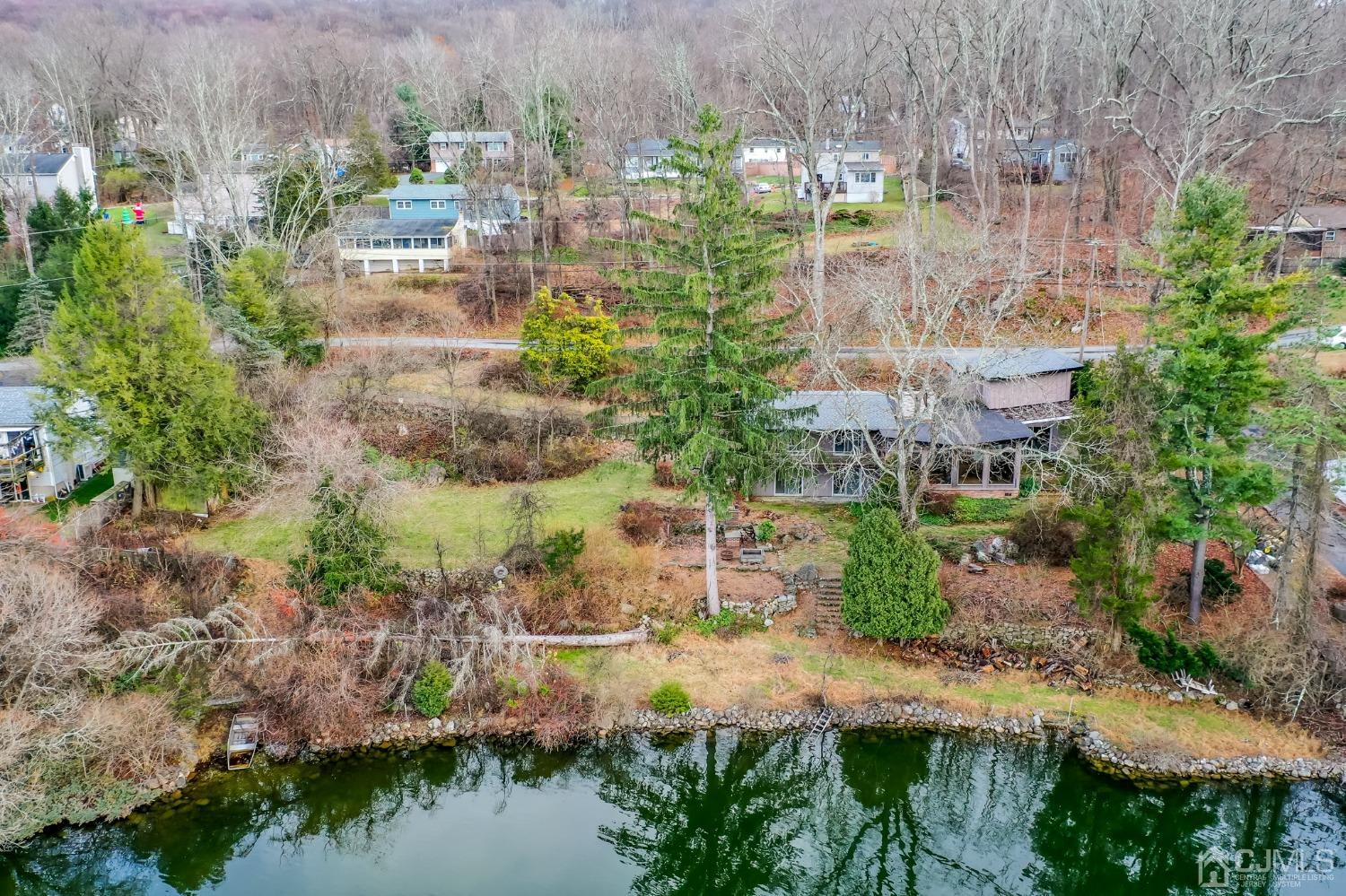 43 Shore Road Andover, NJ 07821 - Photo 20 of 25 an aerial view of residential house with outdoor space and lake view