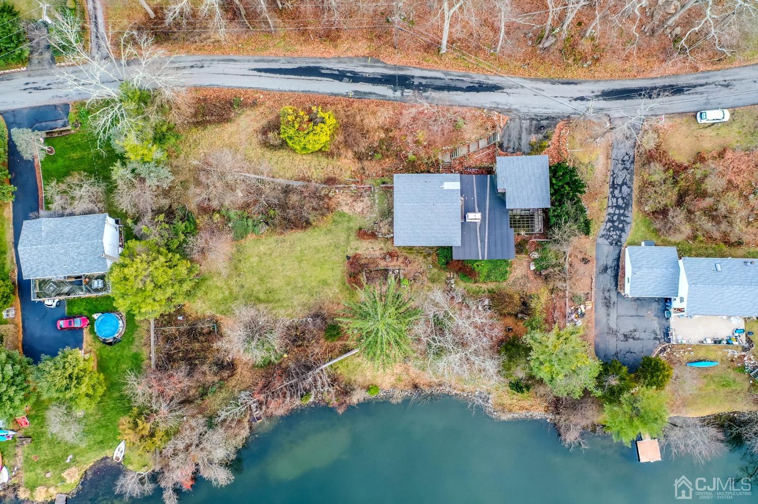 43 Shore Road Andover, NJ 07821 - Photo 22 of 25 an aerial view of a house with a yard basket ball court and outdoor seating