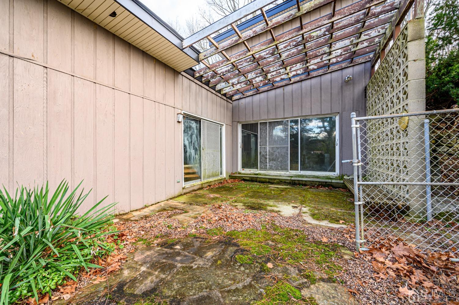 43 Shore Road Andover, NJ 07821 - Photo 5 of 25 a view of a backyard with a large tree and wooden fence