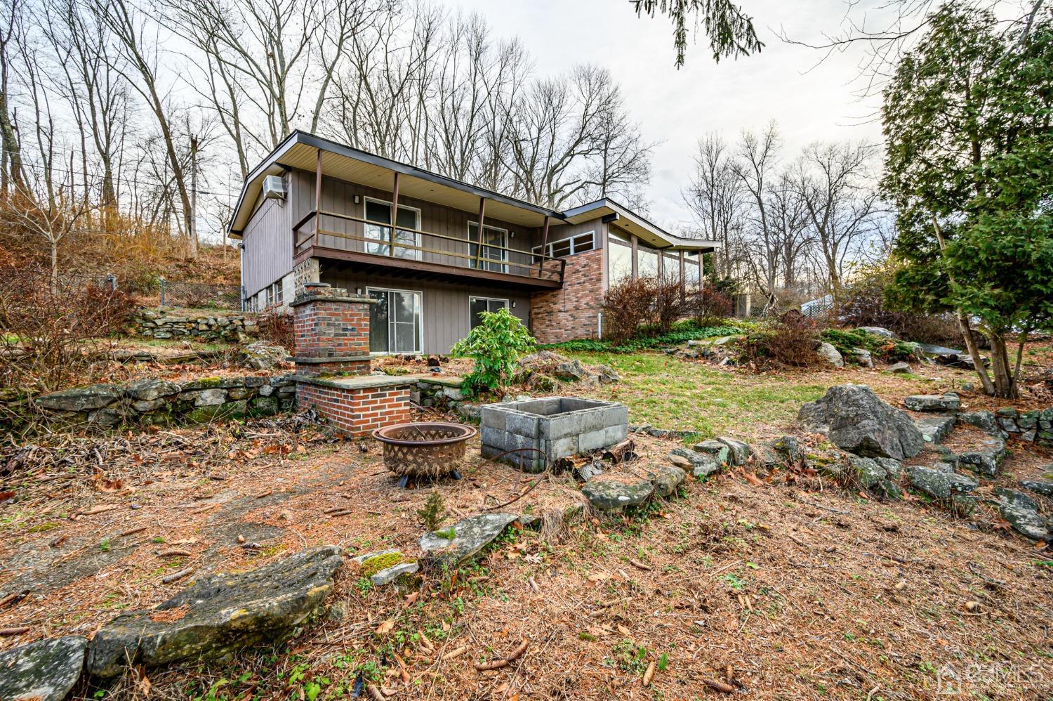 43 Shore Road Andover, NJ 07821 - Photo 7 of 25 a front view of a house with garden