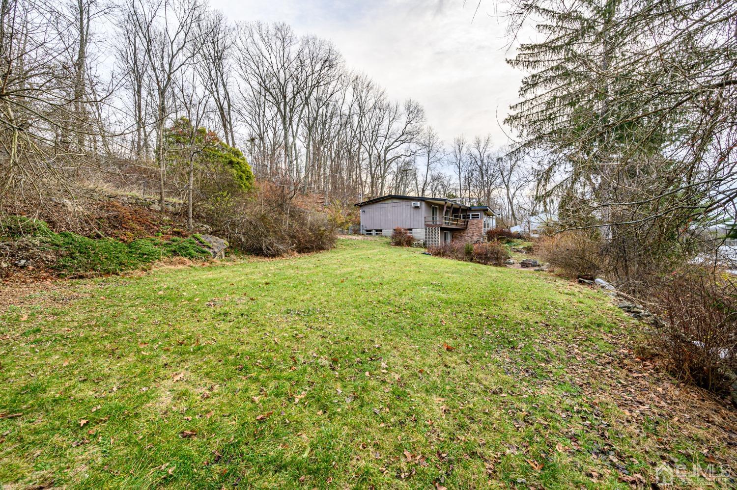 43 Shore Road Andover, NJ 07821 - Photo 10 of 25 a view of a yard with large trees