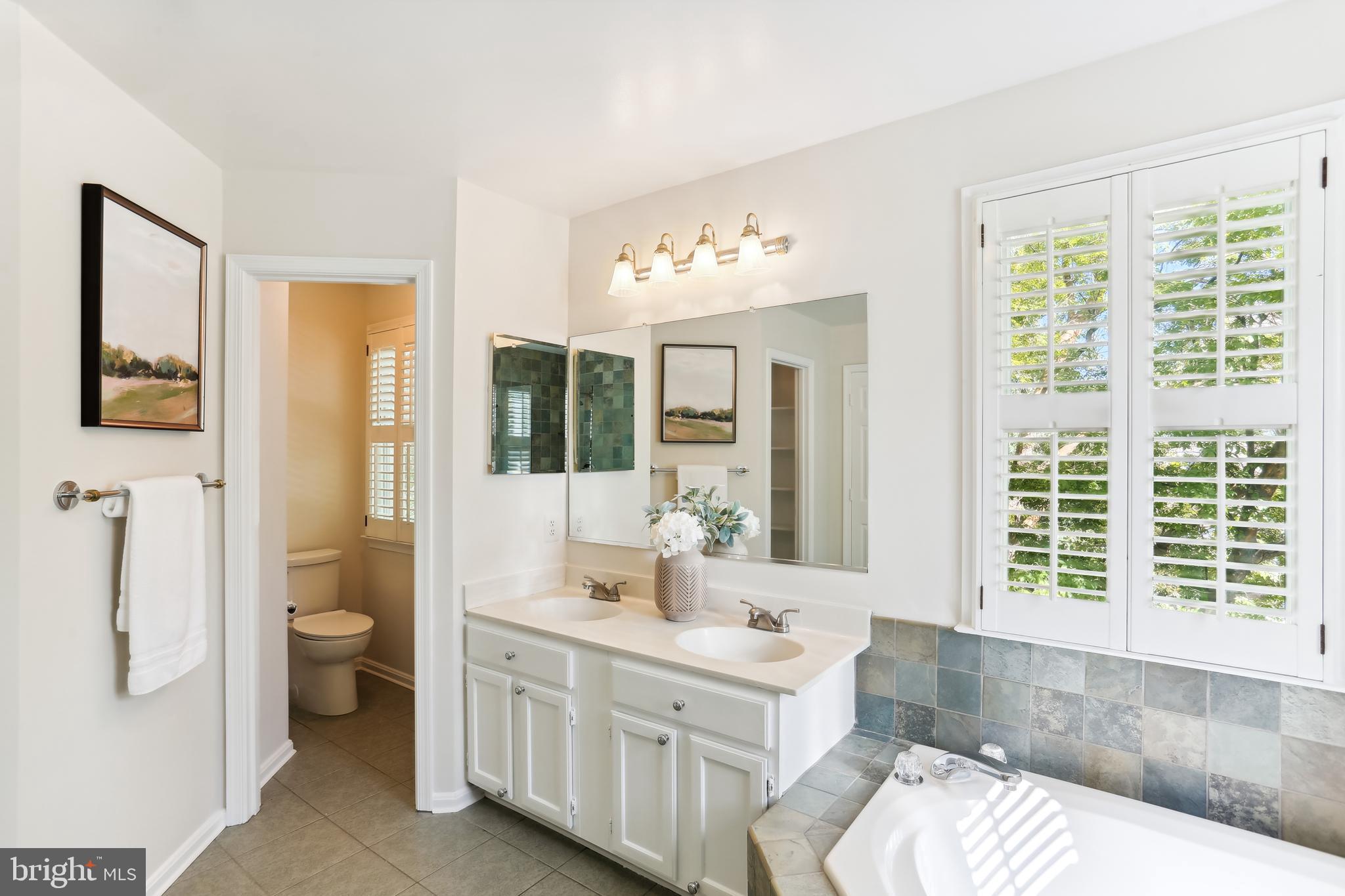 302 Little Quarry Road Gaithersburg, MD 20878 - Photo 21 of 53 Primary bath with custom tilework and lighting