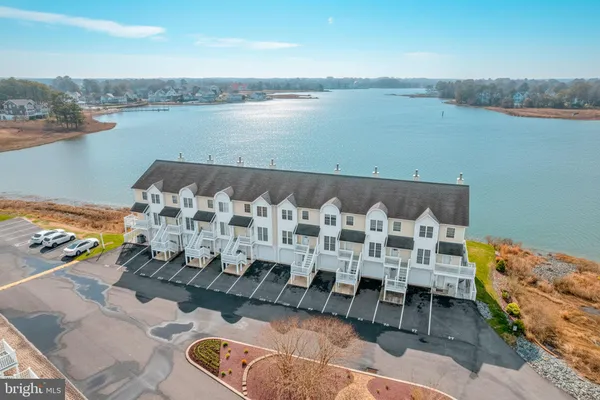 a view of lake with outdoor seating and city view
