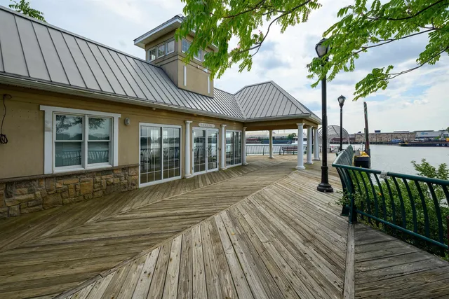 a view of swimming pool with outdoor seating and plants