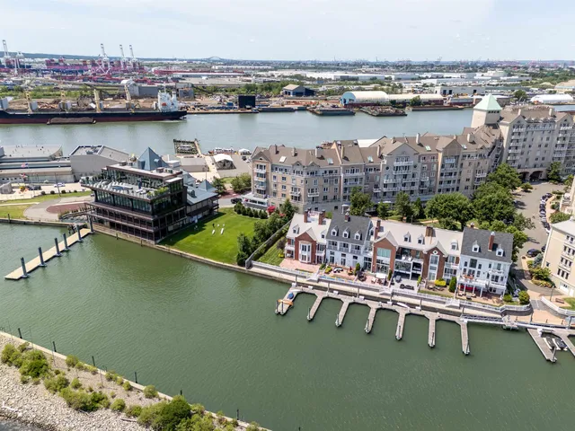 a view of a lake with a table and chairs