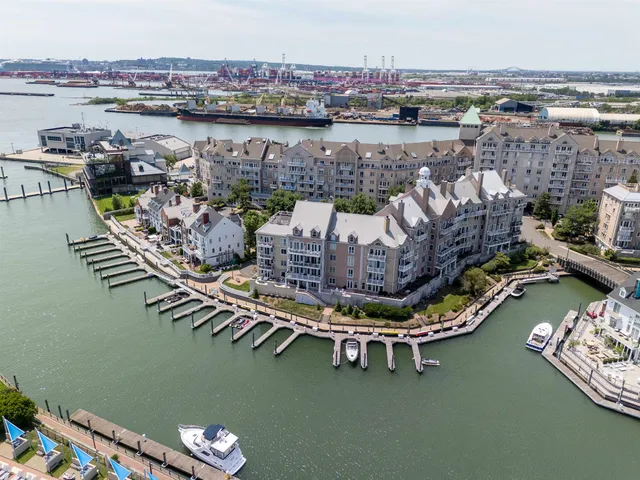 an aerial view of a house with a lake view