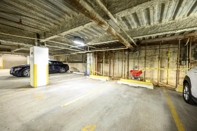 a view of a big room with of big yard and large trees