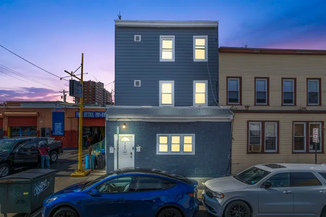 a front view of a house with parking space