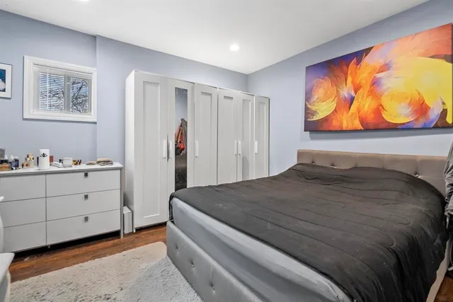 a bedroom with a bed and cabinets