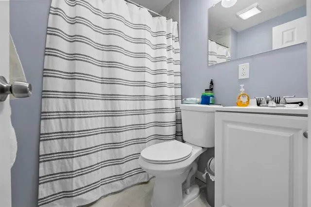 a bathroom with a toilet and a sink