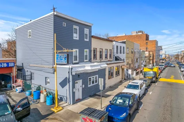 a view of a street with cars