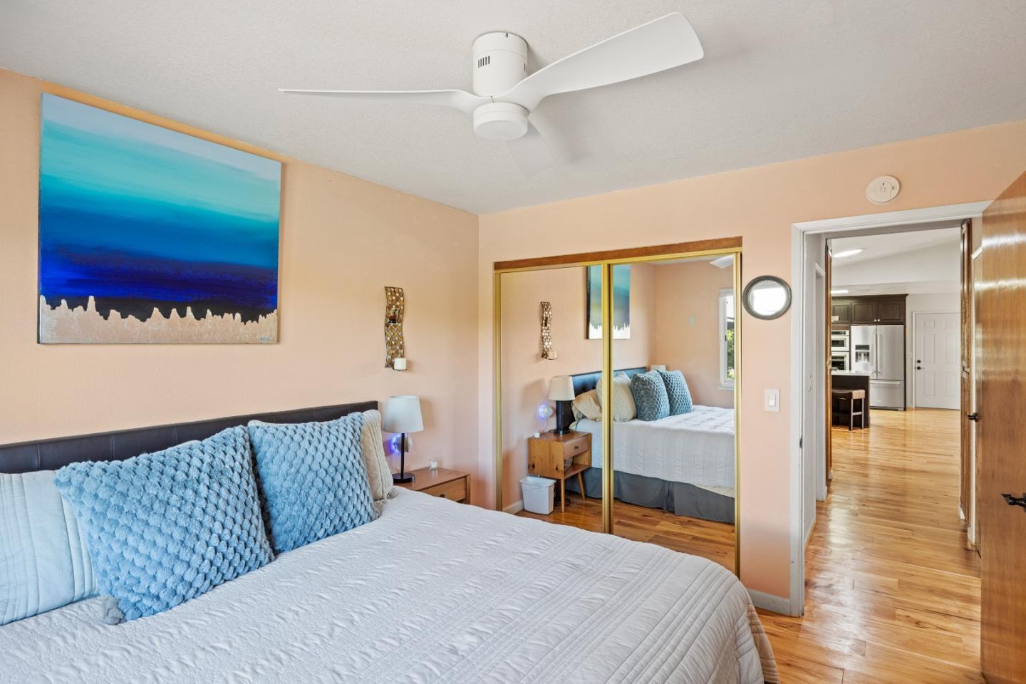 459 Echo Valley Road Salinas, CA 93907 - Photo 17 of 28 a bedroom with a large bed and a chandelier