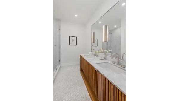 a picture of a bathroom with a shower