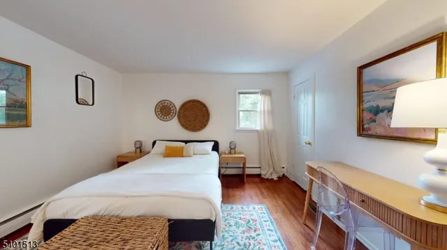 a bed room with a bed and a dresser