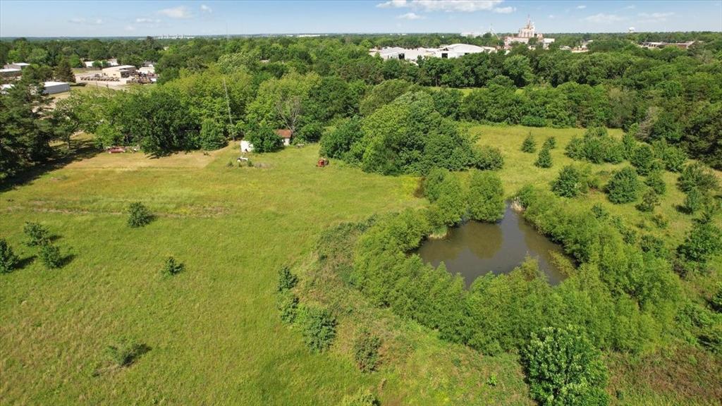 801 Jefferson Road Paris, TX 75460 - Photo 19 of 20 Aerial view of property interior and pond. House, barn, and shed not included.