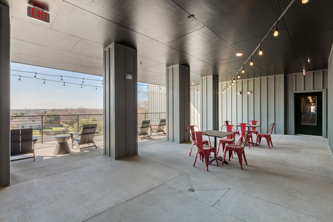 4510 Terry-O Lane, Unit 302 Austin, TX 78745 - Photo 13 of 25 a view of a patio with dining table and chairs