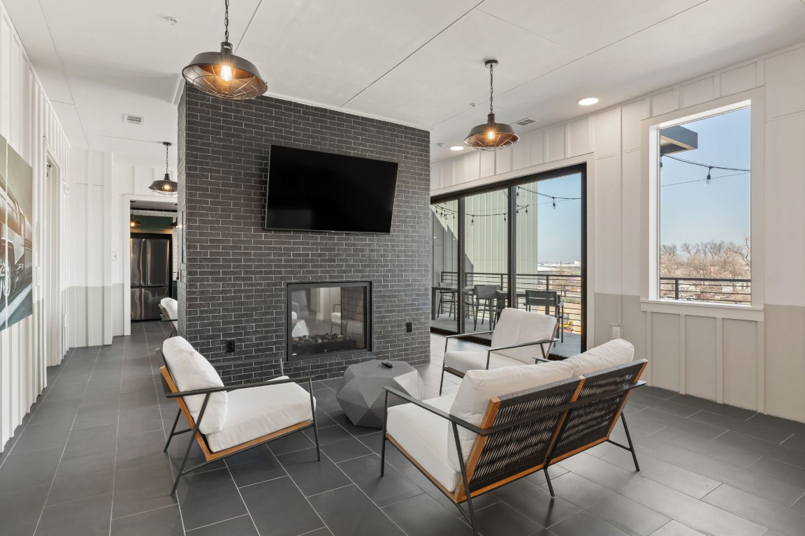 4510 Terry-O Lane, Unit 302 Austin, TX 78745 - Photo 14 of 25 a living room with furniture a flat screen tv and a fireplace