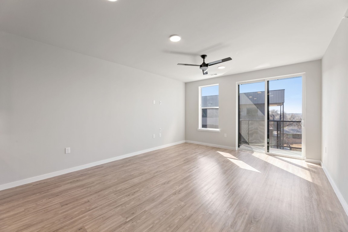 4510 Terry-O Lane, Unit 302 Austin, TX 78745 - Photo 4 of 25 wooden floor in an empty room with a window