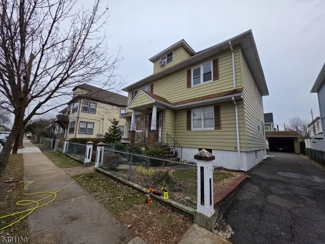 a front view of a house with garage