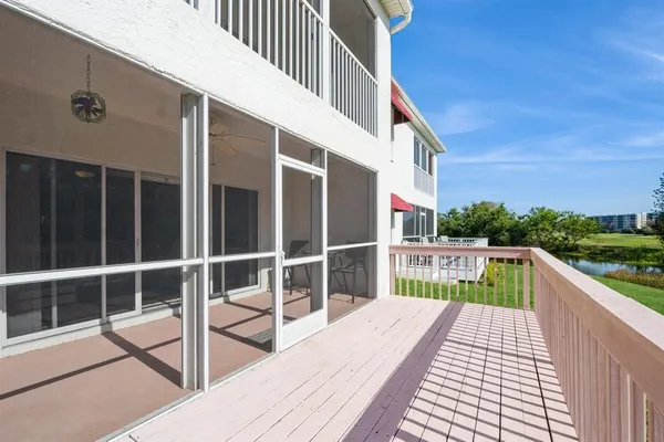 a balcony with view of swimming pool
