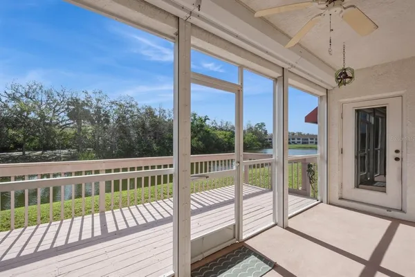 a view of a balcony with wooden floor