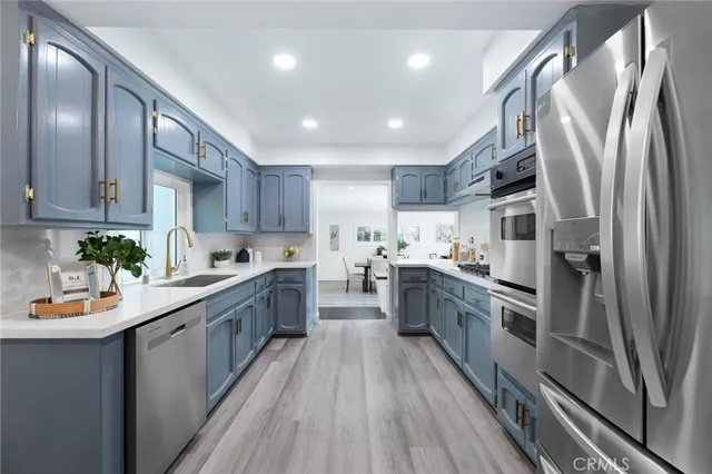 a kitchen with sink cabinets and counter top space