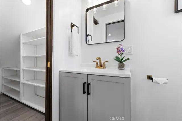 a view of staircase with white walls and a window