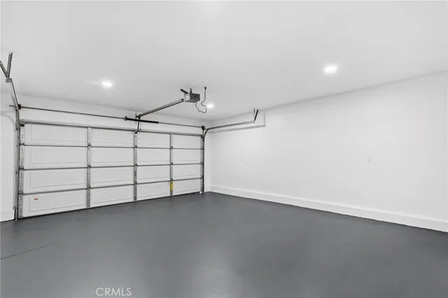 a view of a patio with couches and table and chairs and potted plants