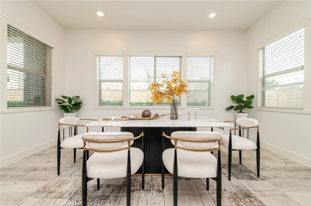 113 Measure Irvine, CA 92618 - Photo 12 of 39 a dining room with furniture and window