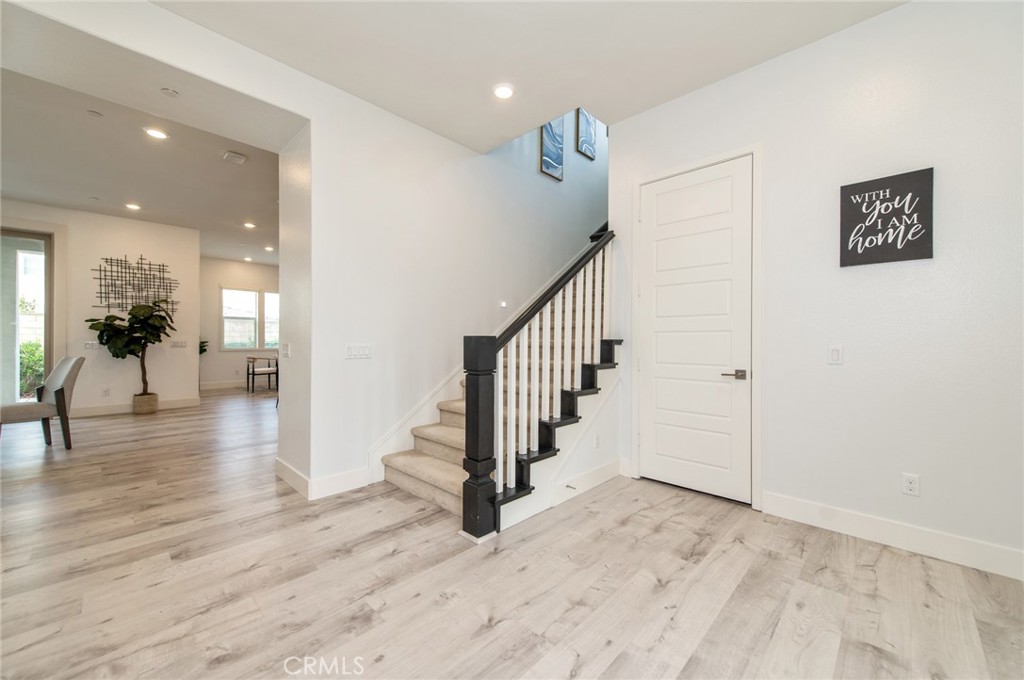 113 Measure Irvine, CA 92618 - Photo 2 of 39 a view of a hallway with wooden floor and staircase