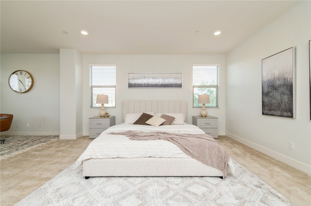 113 Measure Irvine, CA 92618 - Photo 22 of 39 a spacious bedroom with a bed and a window