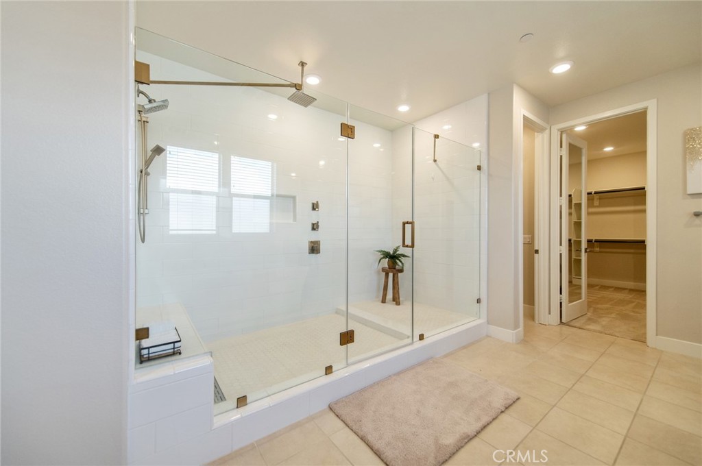 113 Measure Irvine, CA 92618 - Photo 28 of 39 a bathroom with a bathtub and a shower