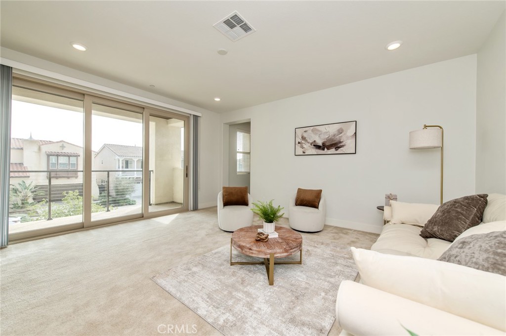 113 Measure Irvine, CA 92618 - Photo 30 of 39 a living room with furniture and a large window