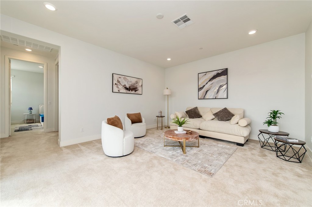 113 Measure Irvine, CA 92618 - Photo 31 of 39 a living room with furniture and white walls