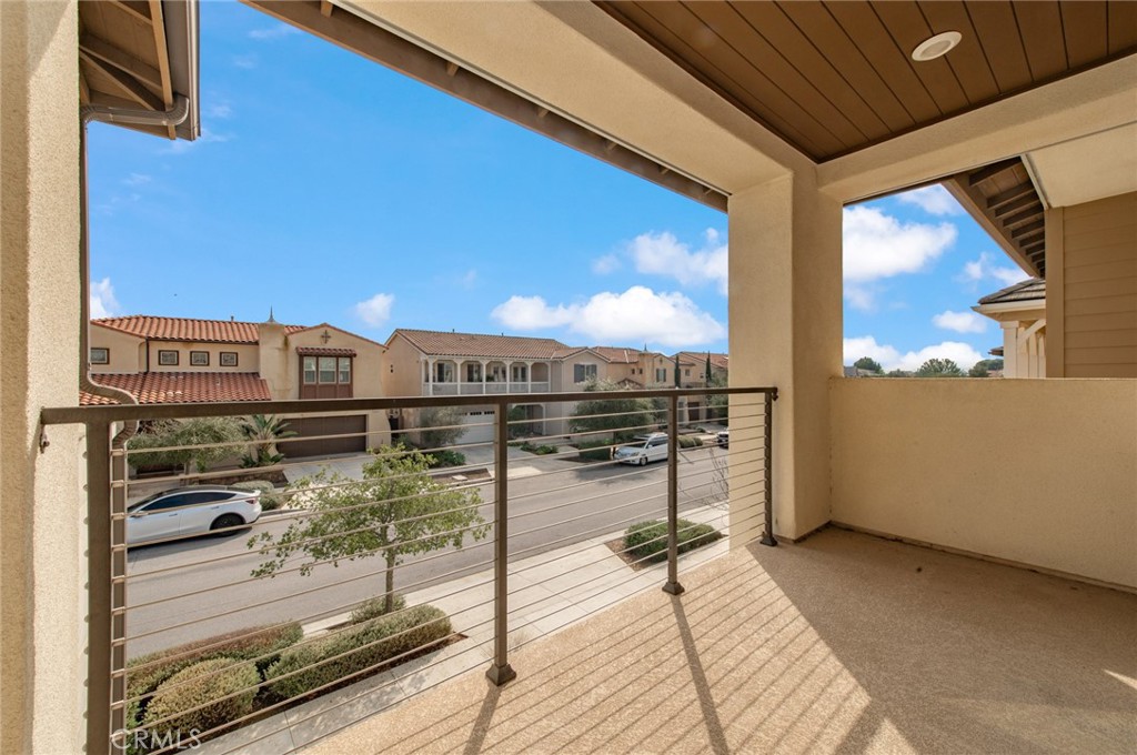 113 Measure Irvine, CA 92618 - Photo 32 of 39 a view of a balcony with wooden floor and iron stairs