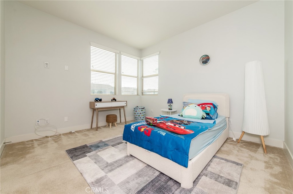 113 Measure Irvine, CA 92618 - Photo 34 of 39 a living room with furniture and a table