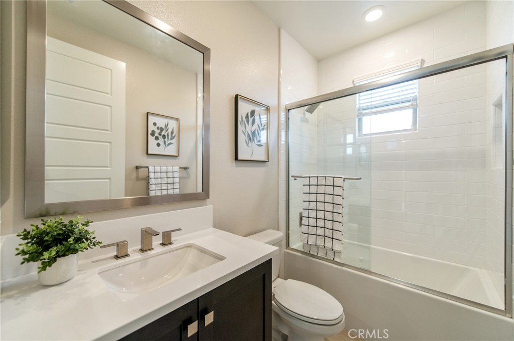 113 Measure Irvine, CA 92618 - Photo 37 of 39 a bathroom with a sink a toilet and shower