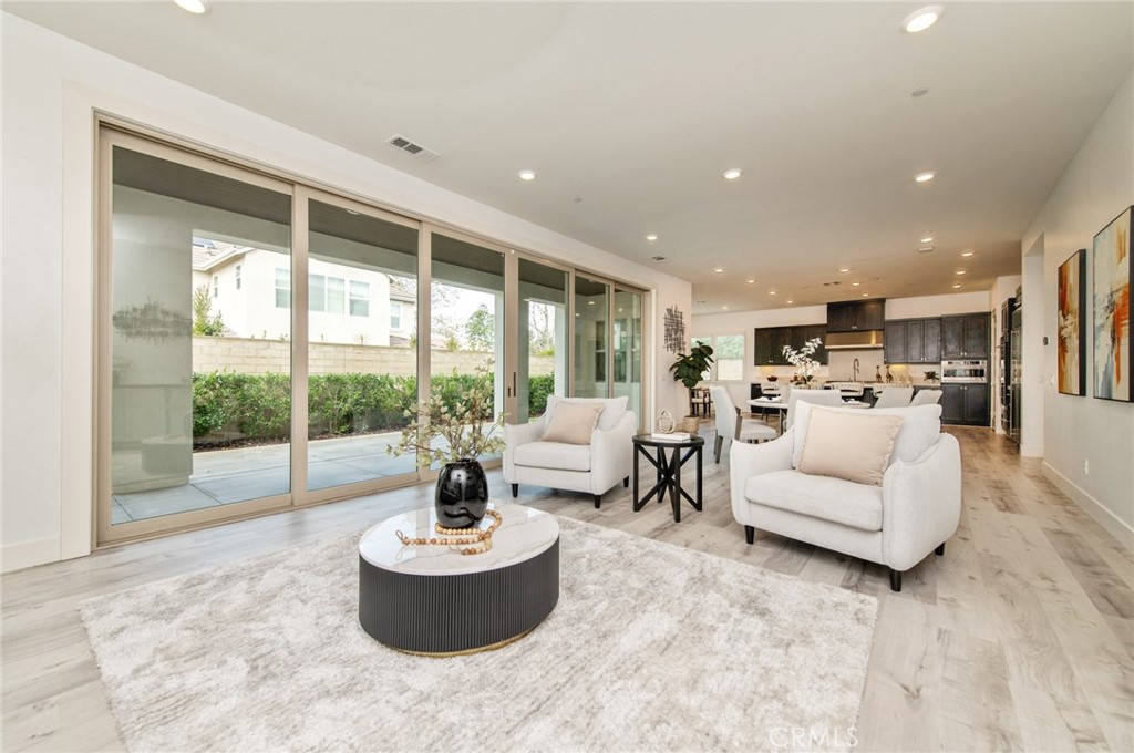 113 Measure Irvine, CA 92618 - Photo 4 of 39 a living room with furniture and a large window