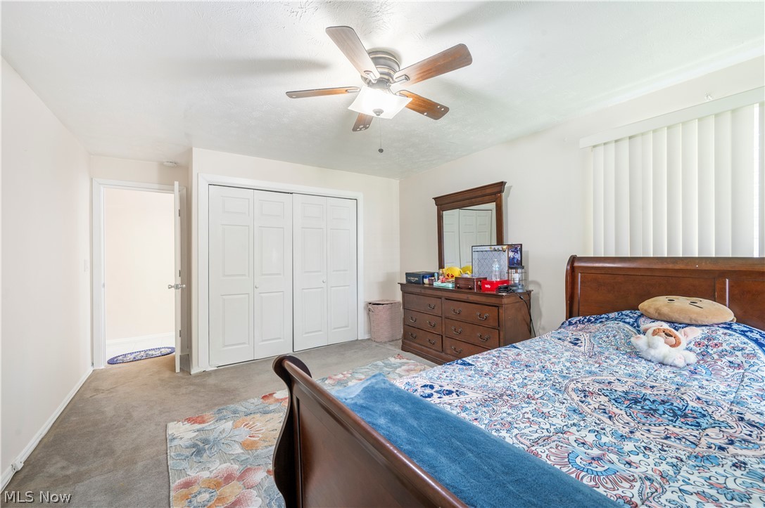 6597 York Road Parma Heights, OH 44130 - Photo 21 of 34 Carpeted bedroom with ceiling fan and a closet