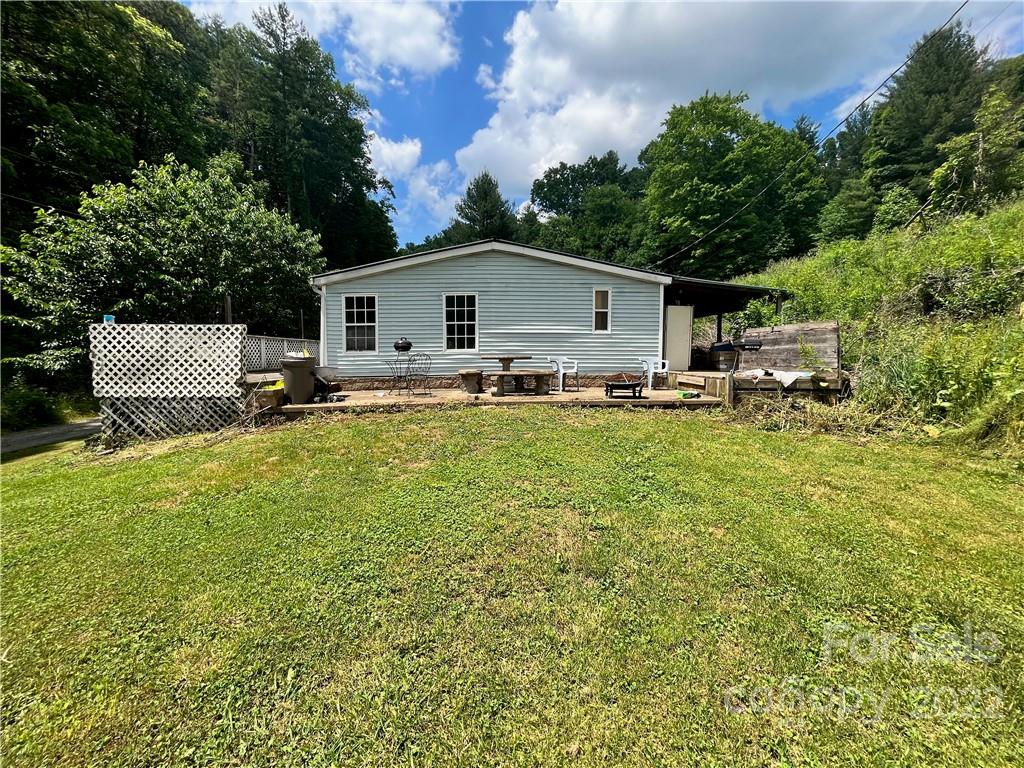 272 Lloyd Drive Mars Hill, NC 28754 - Photo 21 of 21 a house view with a garden space